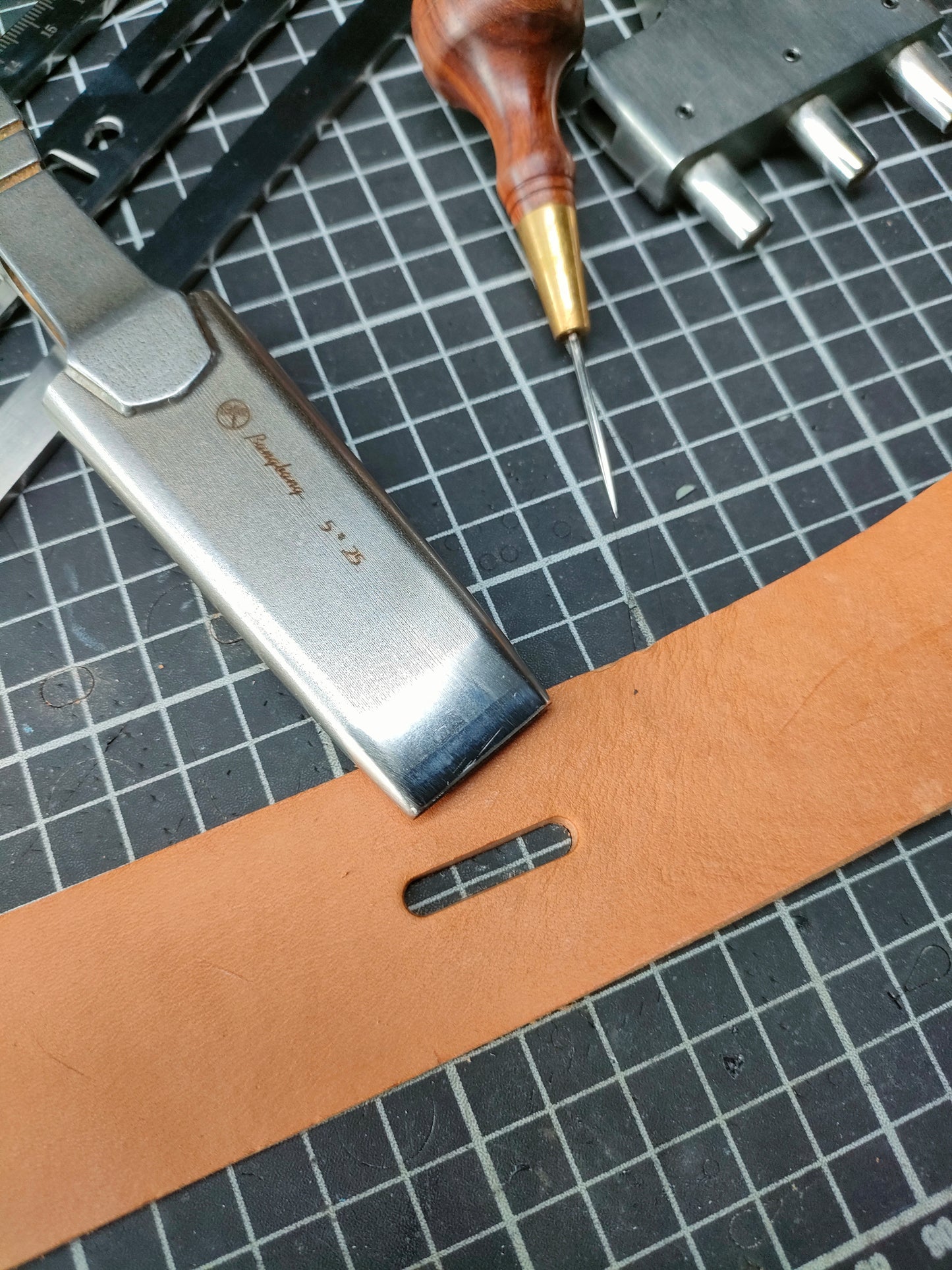 Custom oblong punches (sword handle)